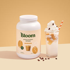 Bloom Nutrition Whey Isolate Iced Coffee powder being poured highlights quick-digesting protein benefits