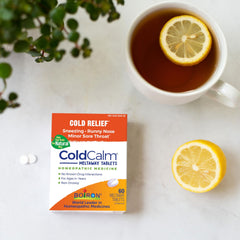 Front view of ColdCalm box paired with Oscillococcinum box
