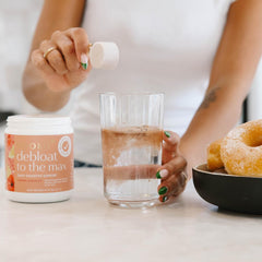 Pour-ready bottle and glass with Boobie Debloat to the Max invite easy daily rituals.