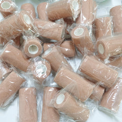 BQTQ beige rolls stacked ready for replacement ensures continuous care.