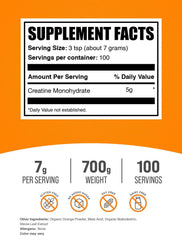 BulkSupplements Creatine Monohydrate Orange Smash being poured into a glass.
