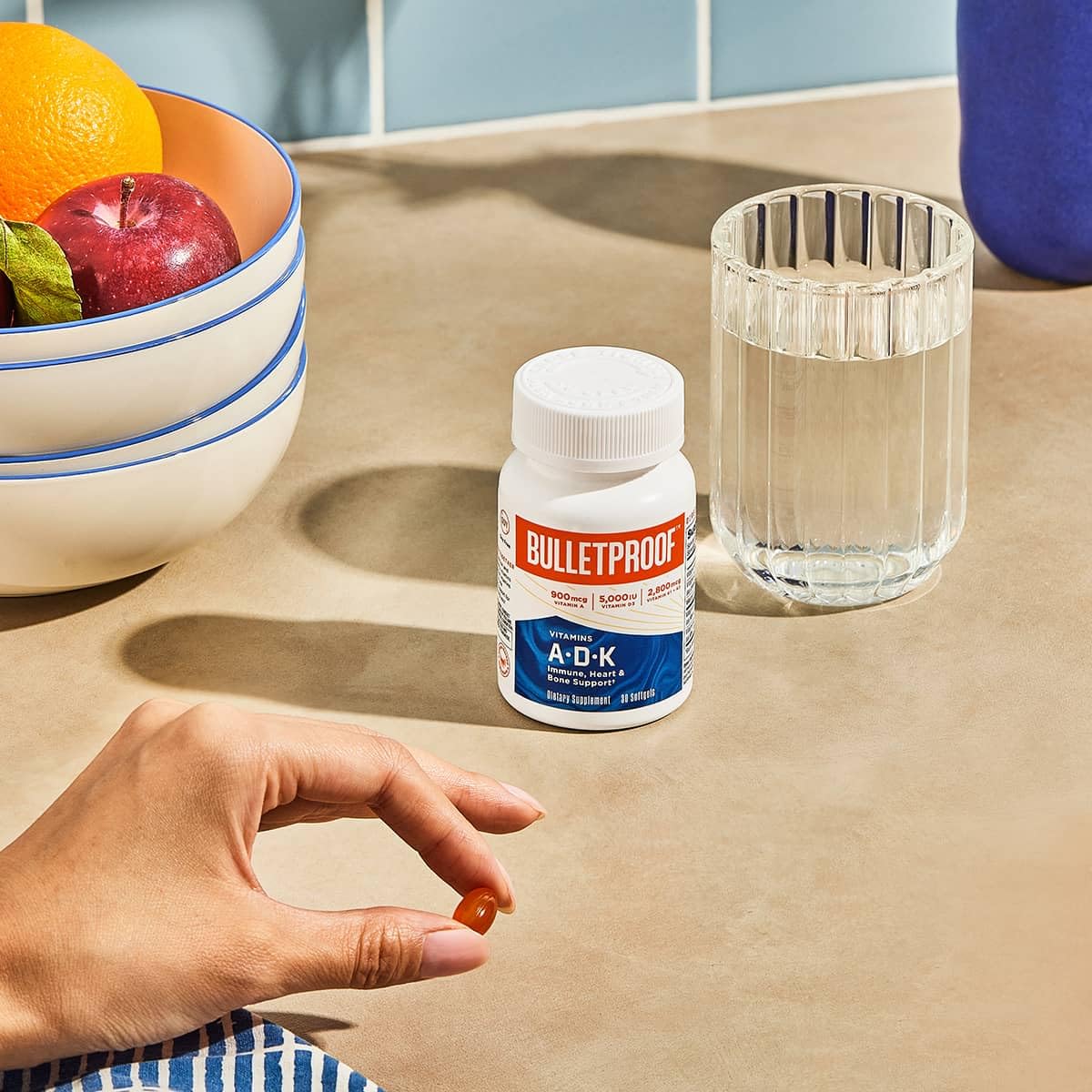Closeup of Bulletproof A-D-K softgels capsules emphasizing dosage
