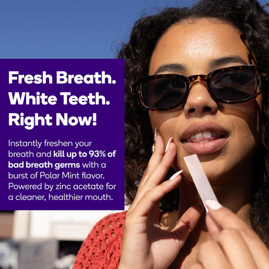 Burst Polar Mint strip dissolving on teeth for quick whitening and fresh breath.