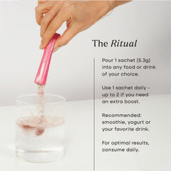Daily routine setup with bottle and glass for skin and gut health.