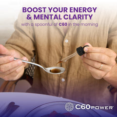 C60 Power Cinnamon bottle on desk with glass and water.