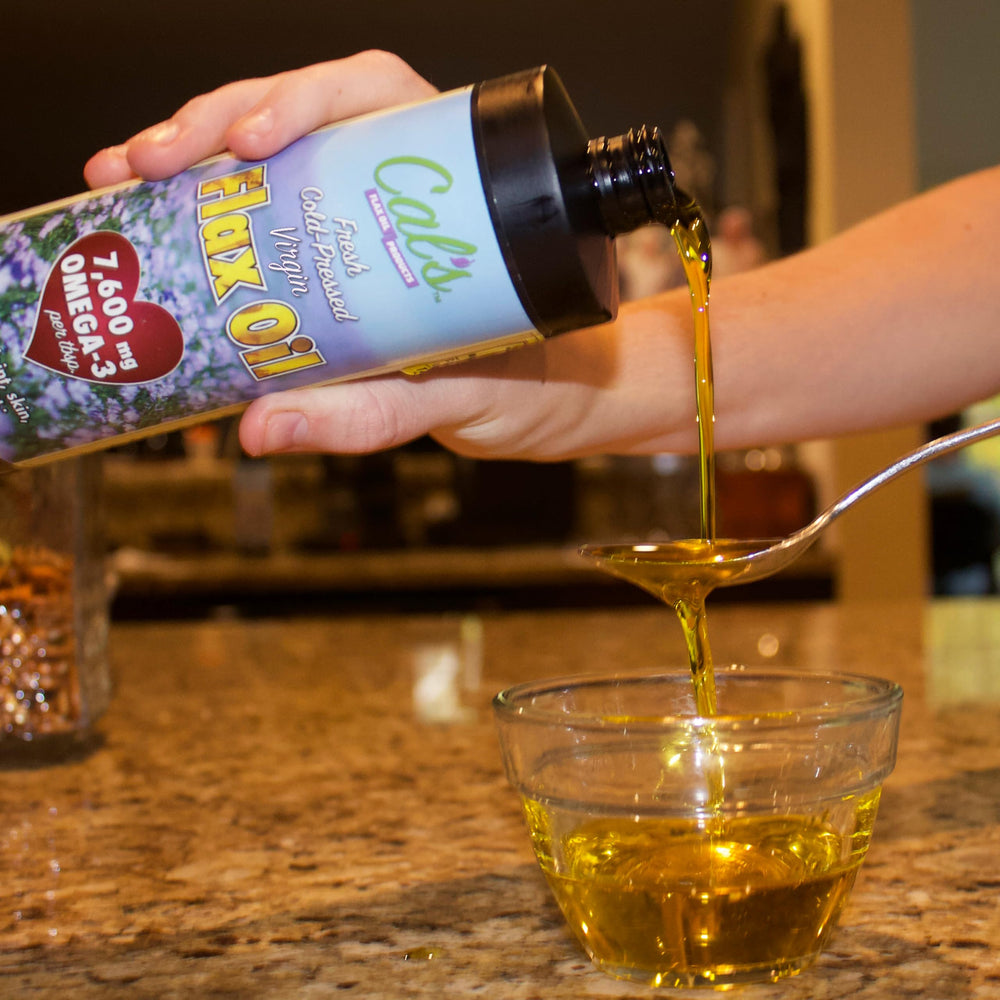 Cal's Flax Oil being poured over salad shows easy daily use