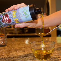 Cal's Flax Oil being poured over salad shows easy daily use