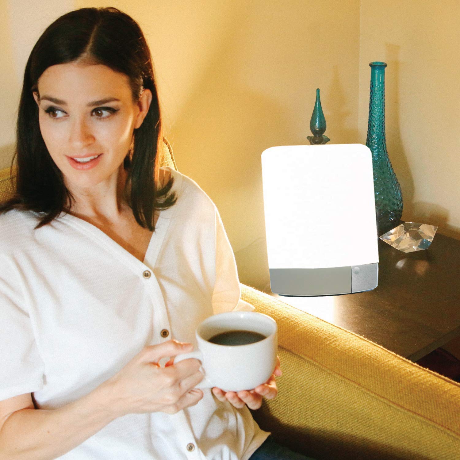 Carex Sunlite tilt-adjustable stand demonstrates customizable height for comfortable use