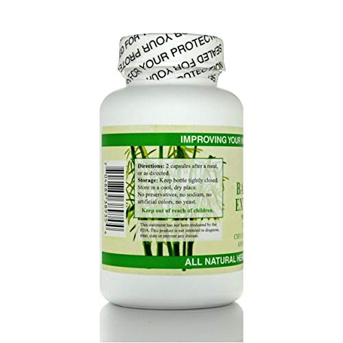 Bottle pouring Chi's Enterprise bamboo extract capsules for effortless dosing.