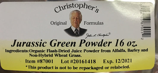 Christopher's Original Formulas Jurassic Green Powder scoop beside glass for easy mixing.