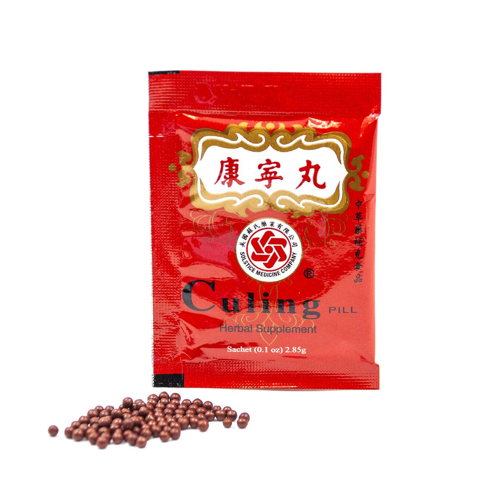 Chu Kiang Brand Culing Pill beside a tea cup for easy consumption