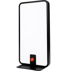 Circadian Optics Langham lamp sits on a desk for mood and focus support