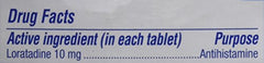 Claritin tablet close-up highlighting 10 mg loratadine per tablet.