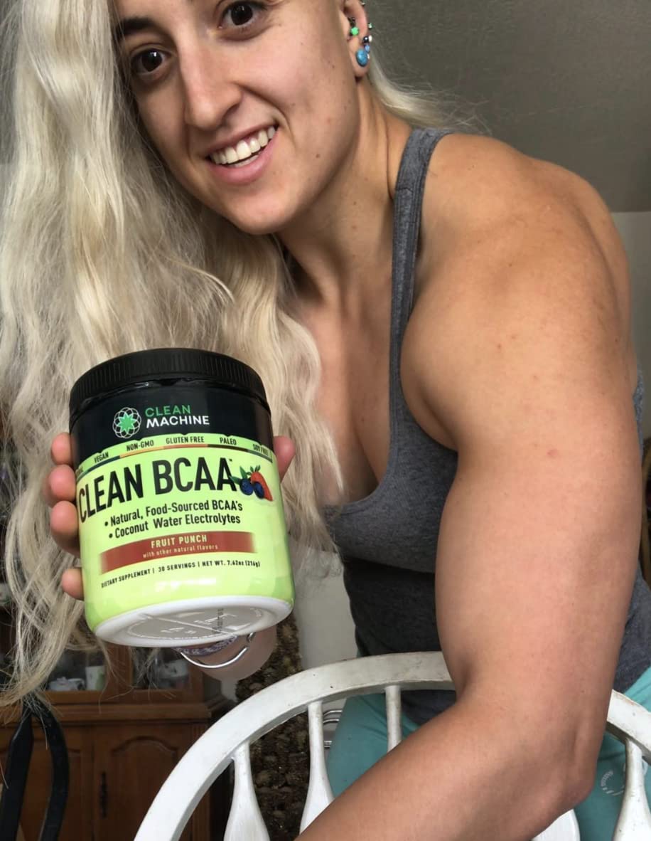 Clean Machine BCAA powder scoop dispensing for precise training measurements.