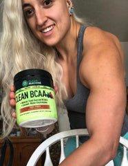 Clean Machine BCAA powder scoop dispensing for precise training measurements.