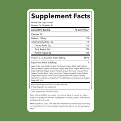 Clean Simple Eats Super Greens powder scoop in glass for quick hydration.