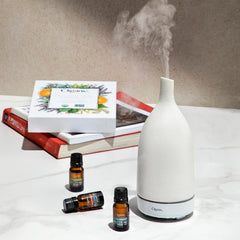 Cliganic tea tree essential oil bottle with clean scent for uplifting cleaning routines