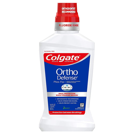 Colgate Phos-Flur mint rinse bottle highlights braces-friendly enamel care.