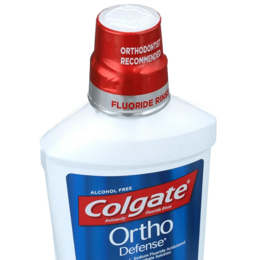 Colgate Phos-Flur ortho-defense mint bottle highlights enamel support.
