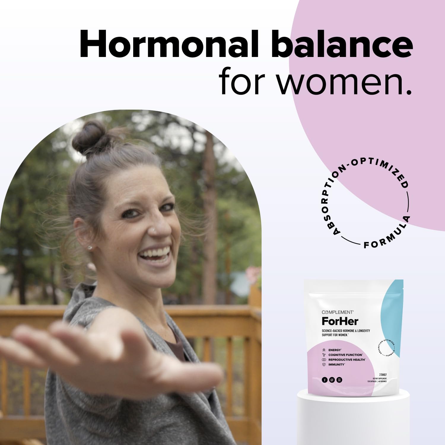 Complement ForHer lifestyle scene with a woman taking vitamins.
