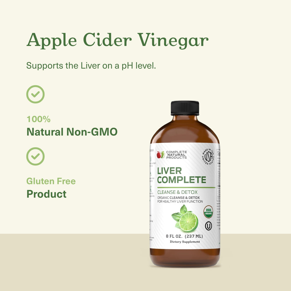 Measuring spoon with Complete Natural Liver Complete Liquid for accurate dosing.