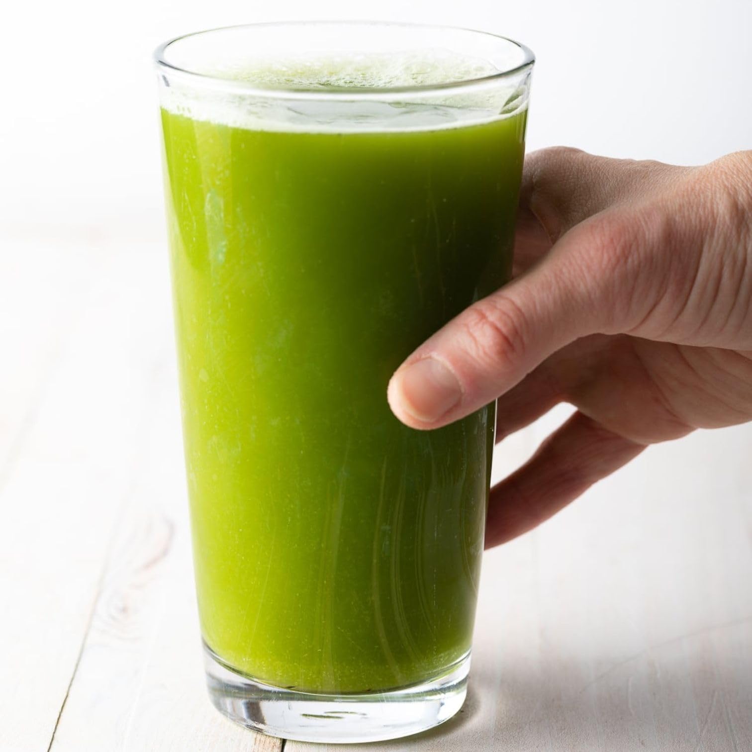 Glass of water with Primo Celery powder for quick hydration.