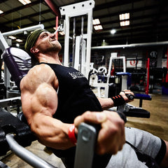 Core Nutritionals Grow Mass scoop beside powder for easy daily fueling.