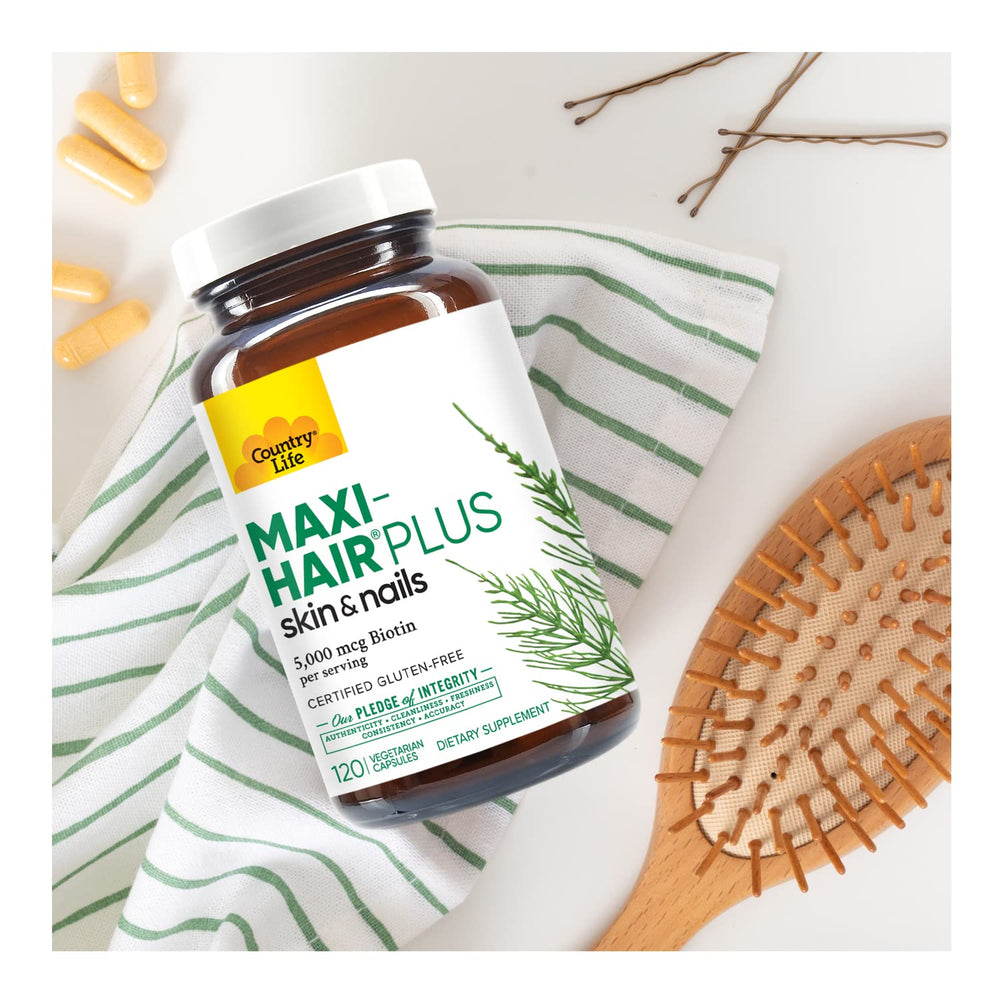 Country Life Maxi-Hair Plus label detail noting biotin content and nutrients.
