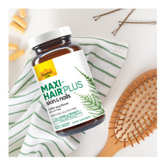 Country Life Maxi-Hair Plus label detail noting biotin content and nutrients.
