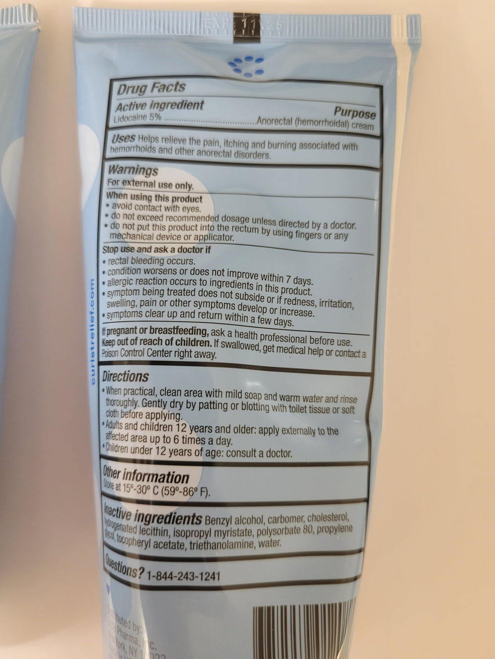 Close-up of Curist lidocaine cream label showing strong OTC formula