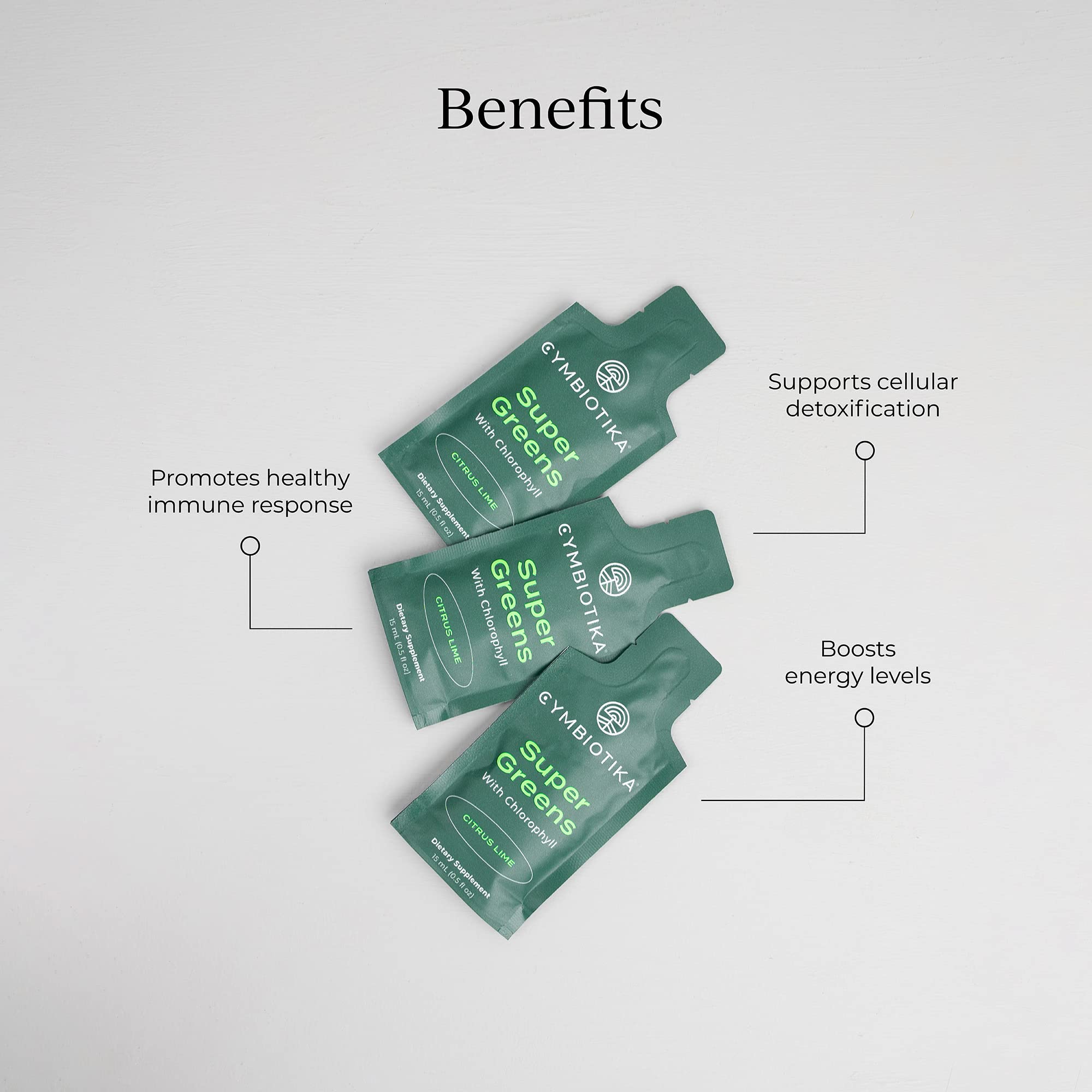 CYMBIOTIKA Super Greens glass with mix shows easy dissolve for a refreshing drink.