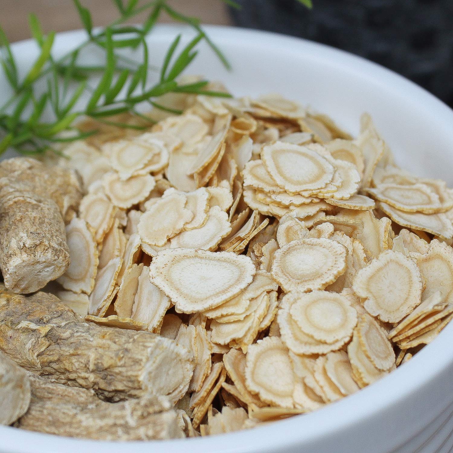 Closeup of DABC OAK LAND ginseng slices showing earthy texture.