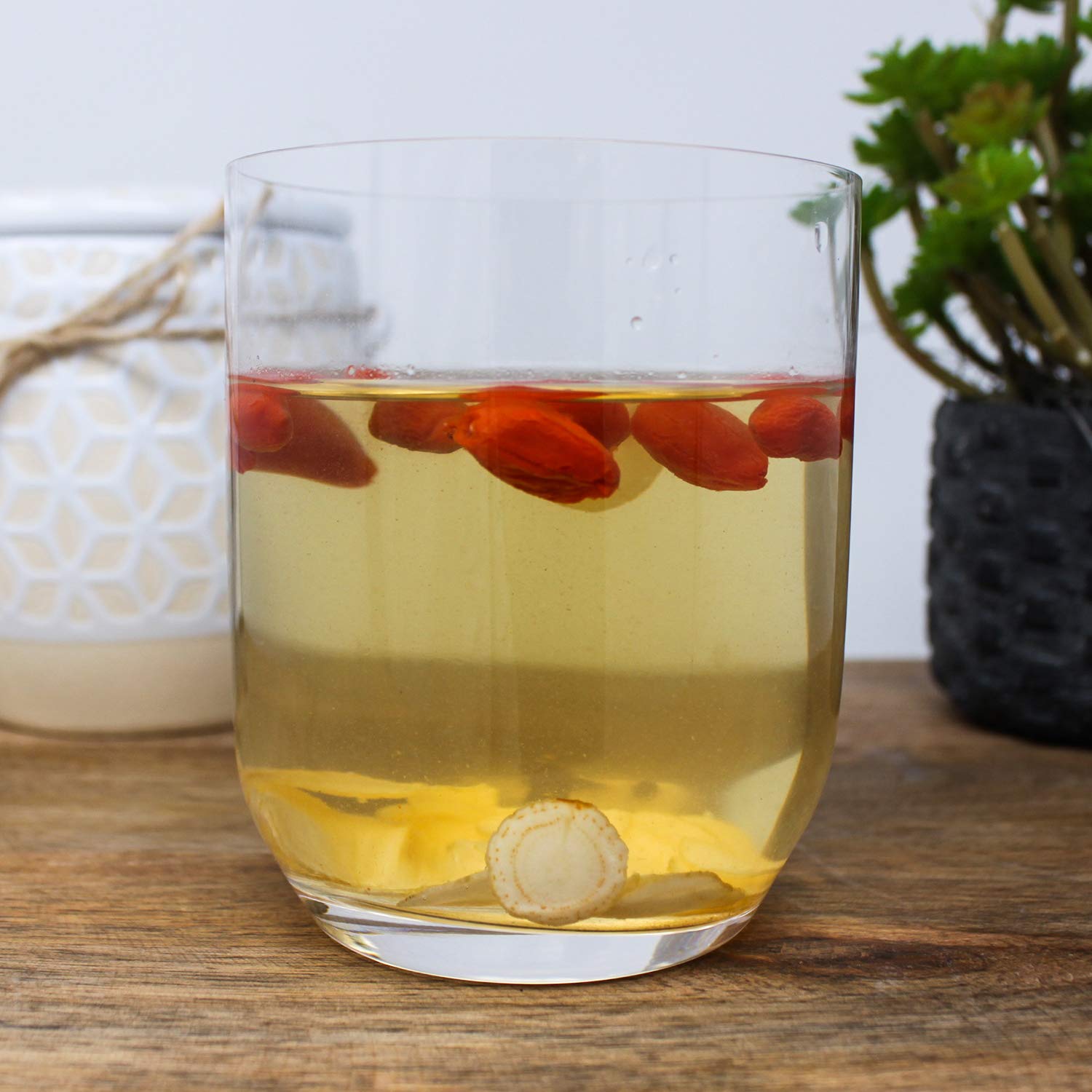 DABC OAK LAND ginseng slices steeped in tea for a gentle lift.