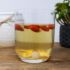 DABC OAK LAND ginseng slices steeped in tea for a gentle lift.