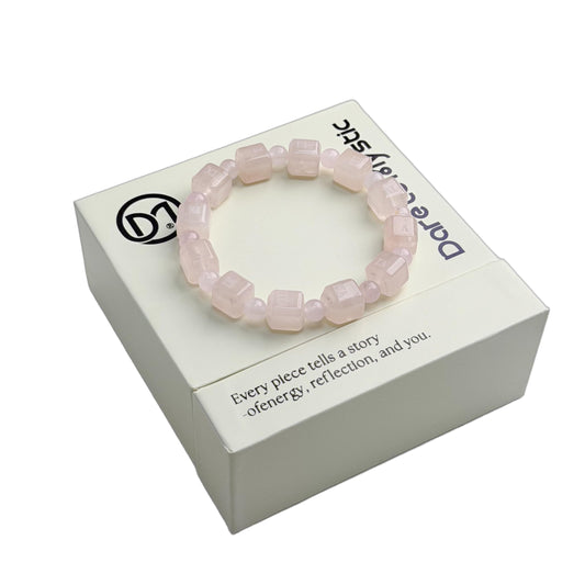 Dare to Mystic rose quartz Roman numeral beads highlight time-inspired design.