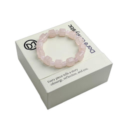 Dare to Mystic rose quartz Roman numeral beads highlight time-inspired design.