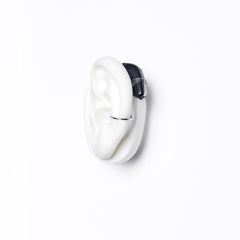 Deafmetal silicone holster on the ear provides universal attachment for behind-the-ear devices.