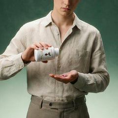 Dear Apothecary Beetroot Capsules pouring into hand for easy daily use.
