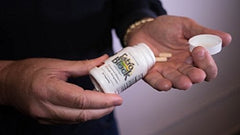 Pouring Estroblock capsules for quick daily intake.