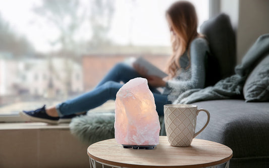 DesertUSA Rose Quartz Lamp side view shows natural stone with a soft pink glow.