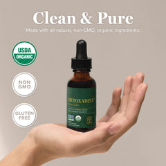 Detoxadine bottle label close-up highlighting vegan and non-GMO status.
