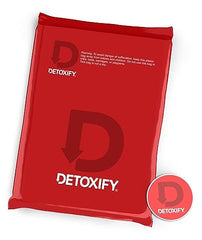 Detoxify Xxtra Clean tropical fruit bottle front label showing flavor and ingredients for an energizing routine