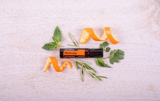 doTERRA Motivate Touch roll-on applied to the wrist for on-the-go energy