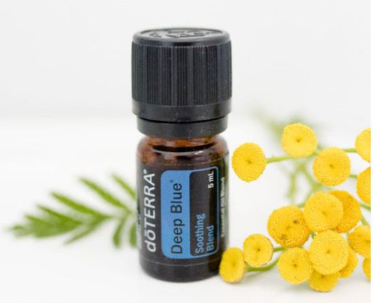 doTERRA Deep Blue bottle pour, ready for post-workout massage application.