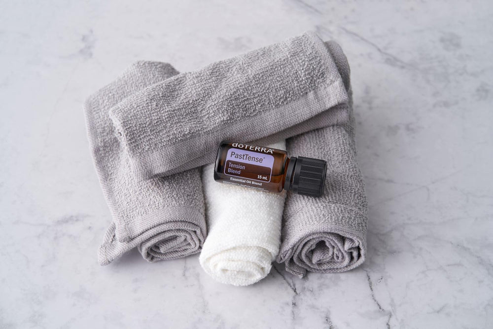 PastTense bottle placed beside a diffuser to create a calm atmosphere.