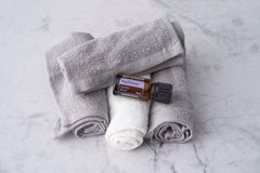 PastTense bottle placed beside a diffuser to create a calm atmosphere.