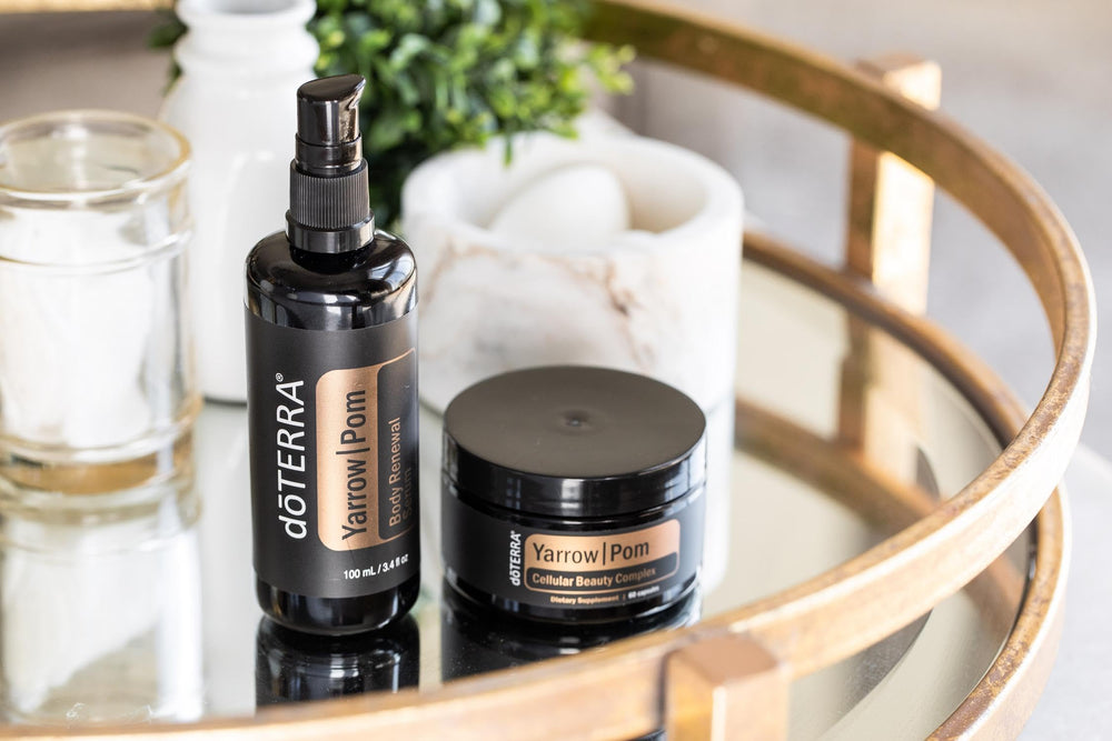 doTERRA Yarrow Pom Capsules glass bottle on wood evokes premium skincare