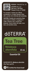 doTERRA Melaleuca oil bottle on a wood table for home cleaning.