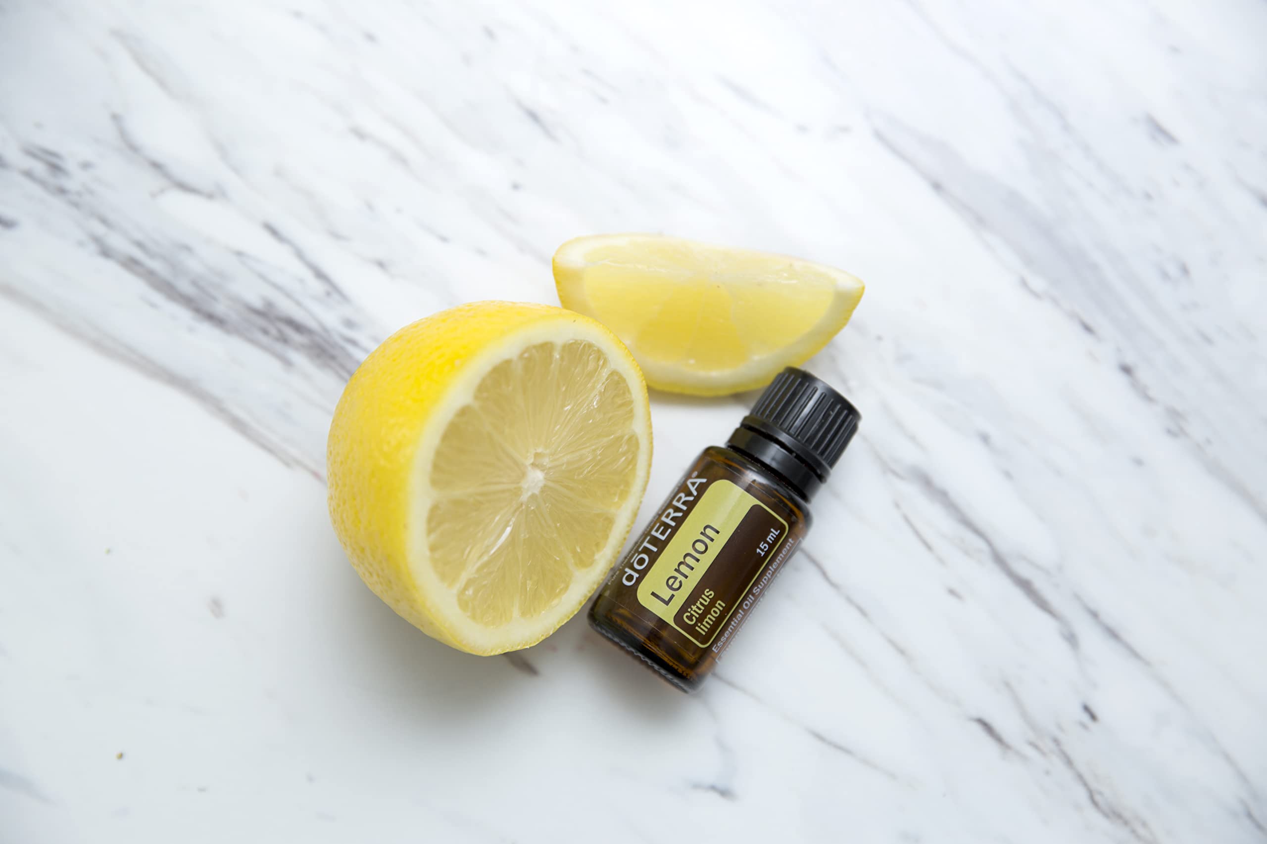 doTERRA Lemon essential oil cap closeup showing bright citrus aroma.