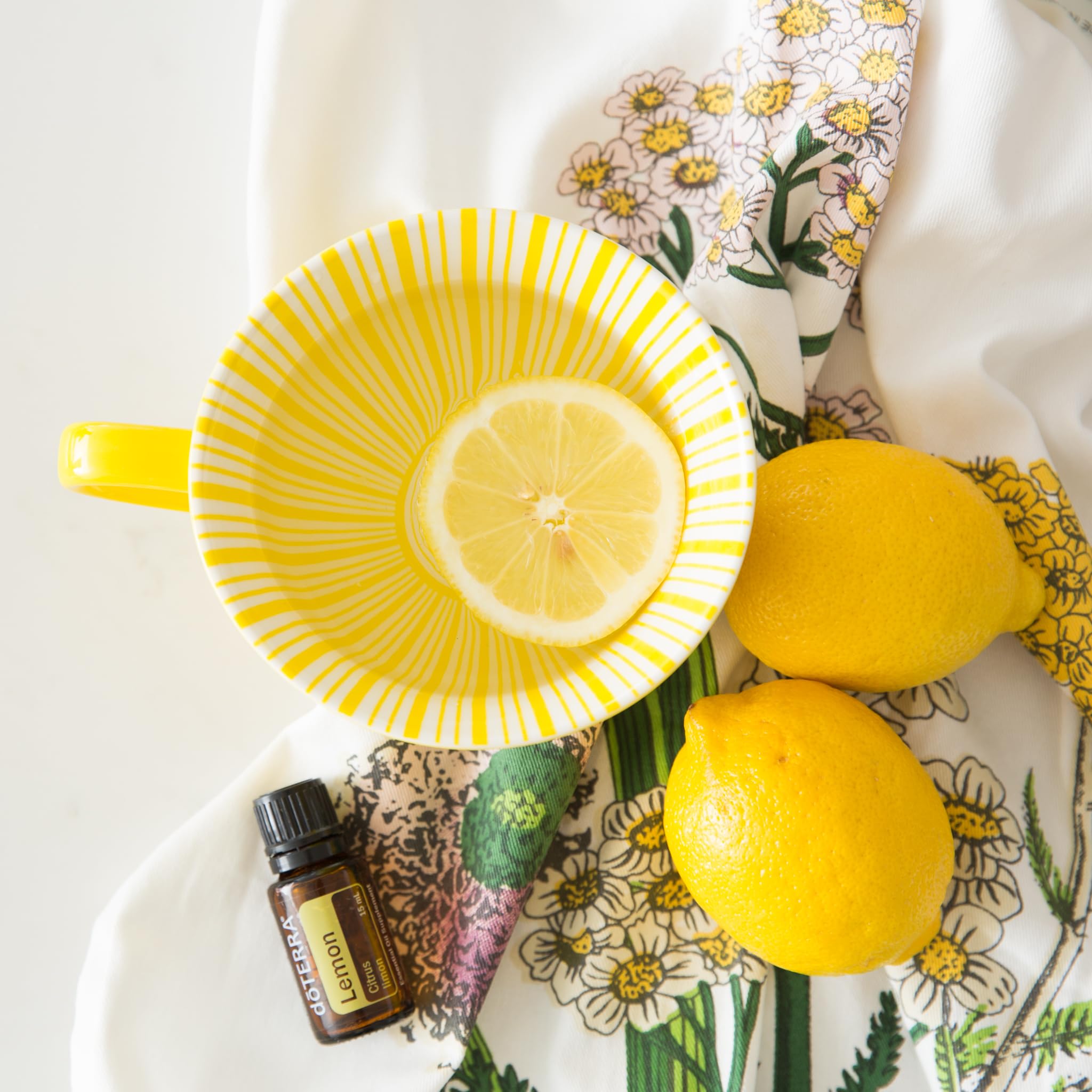 doTERRA lemon oil bottle with dropper showing versatile uses.